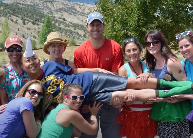 Dr. Keith Weisz being lifted up by friends and staff