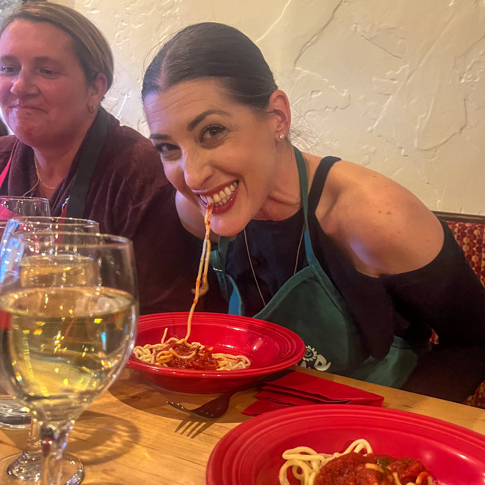 woman eating spaghetti with no hands