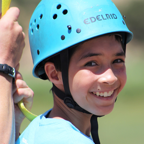 Happy camper with climbing helmet on