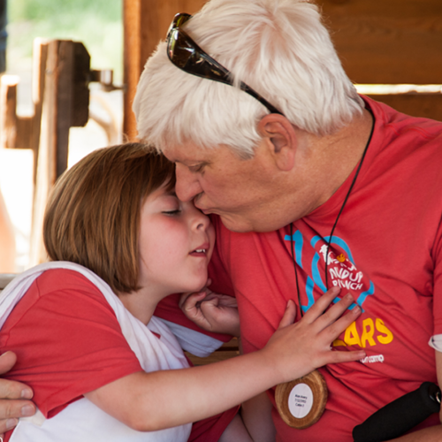 Father kissing his daughter