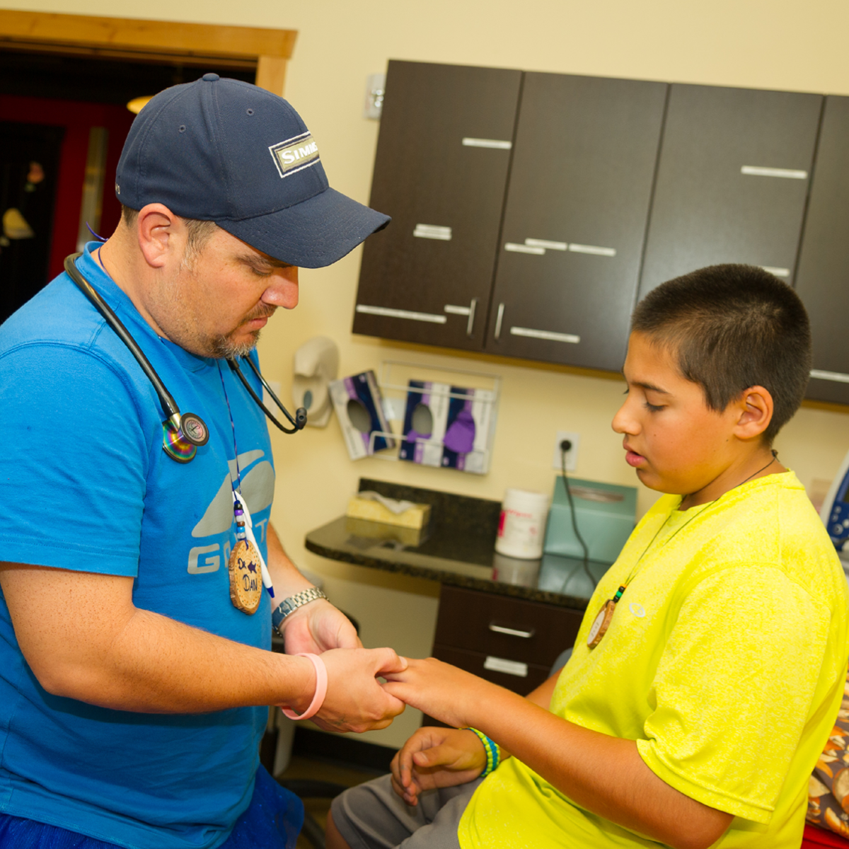 Medical Volunteer helping with a camper