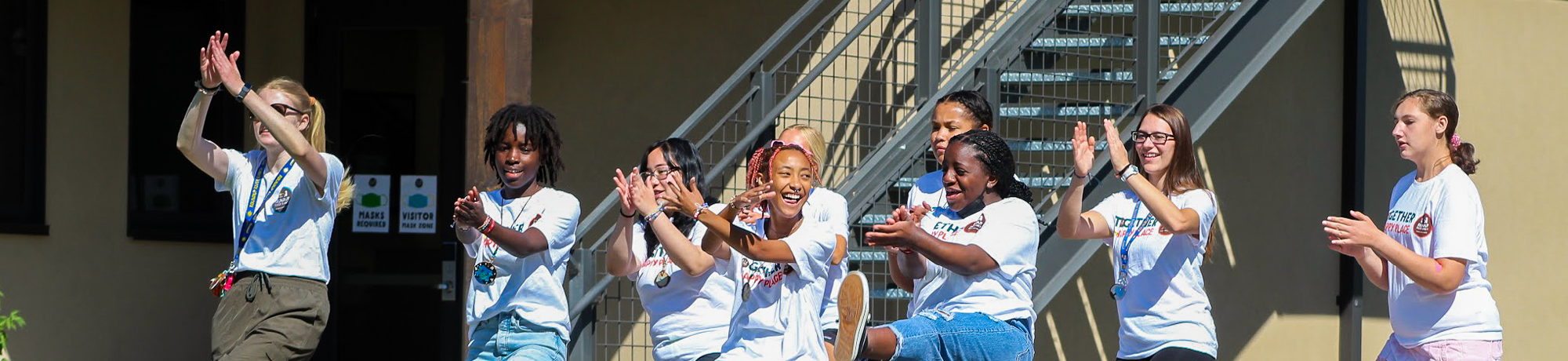 Camper volunteers cheering together