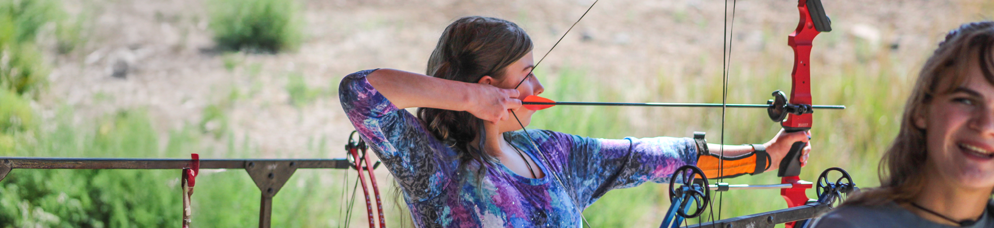 camper doing archery