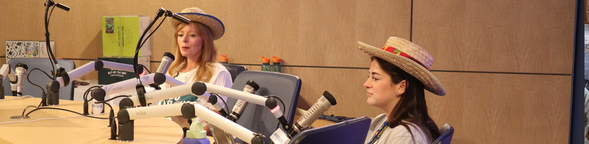 two women broadcasting at Seacrest Studios