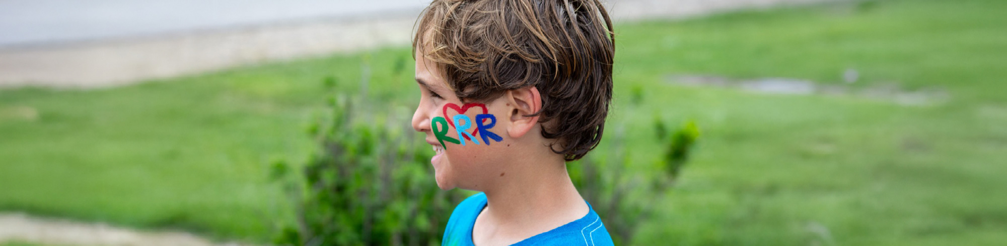 camper with RRR on his face