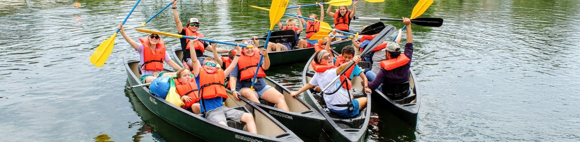Proud camper reaching the top of the climbing wall.