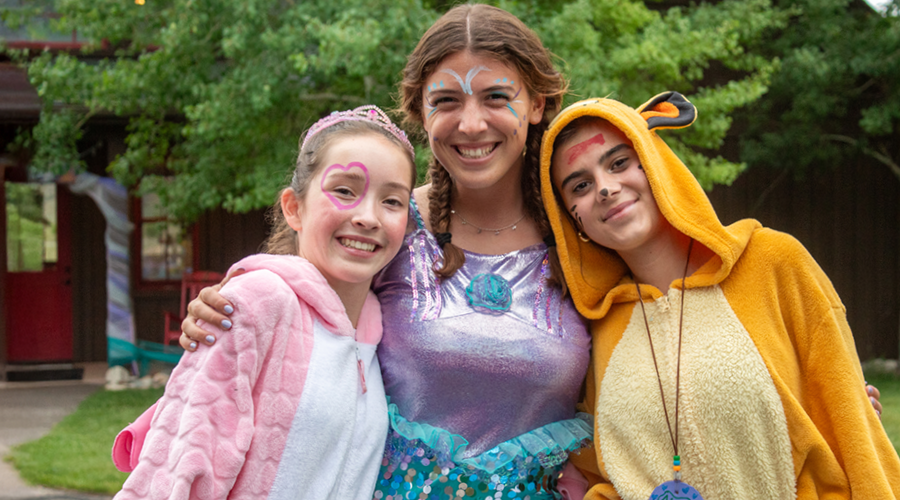 Three campers and camp counselor