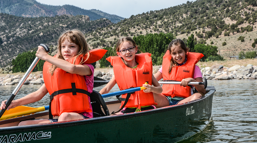 There campers canoeing