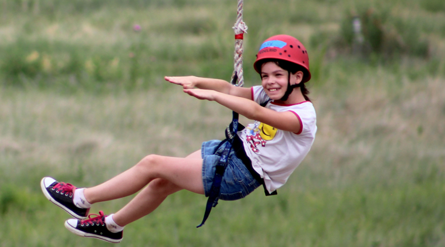 camper on zipline
