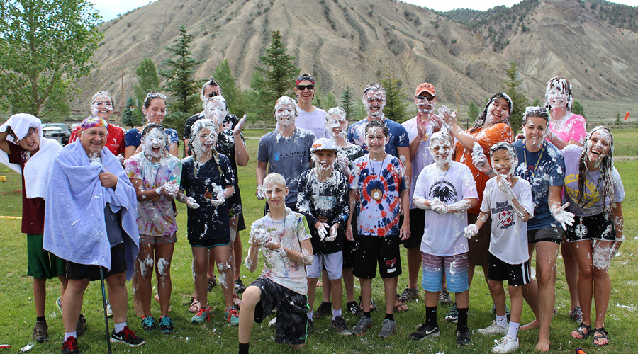 campers with shaving cream all over them