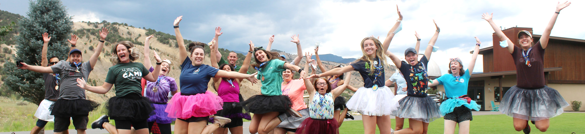 Roundup River Ranch volunteers, staff jumping for joy.
