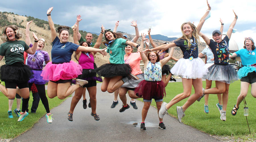 Roundup River Ranch volunteers, staff jumping for joy.