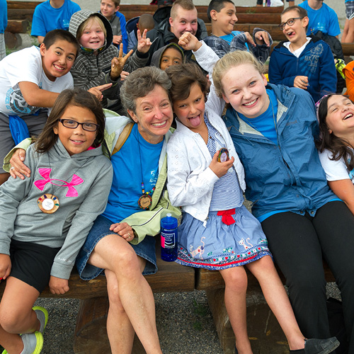 Group of campers having fun and smiling at camera